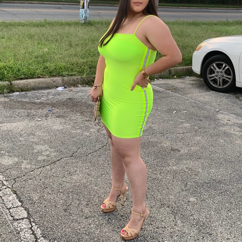 Neon green dress with reflective sides.